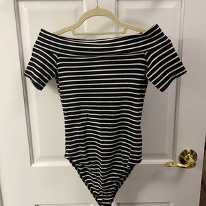 Strapless black and white striped body suit
